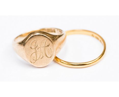 One 9ct gold oval signet ring engraved, size K1/2,  one 22ct band, approx 1.5mm wide with a combined total weight approx 6.9 