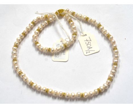 A Freshwater pearl necklace and bracelet set, the necklace with round white pearls with Swarovski crystal set spacers between