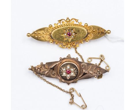 Two Victorian gold estruscan style brooches, comprising a ruby and diamond set and a ruby and seed pearl set 