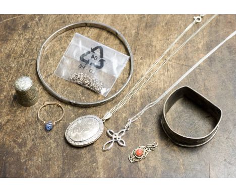 A silver bangle, napkin ring, chain and gold wire ring and silver thimble and pendant/locket and chain, etc (q) 