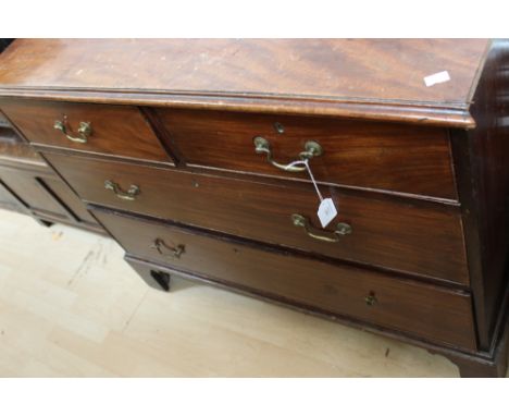 A George III mahogany chest of drawers, comprising two short over two long graduated drawers, standing on bracket feet