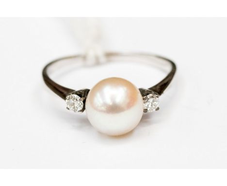 Fresh water cultured pearl and diamond ring approx pearl size 7mm  on a white metal band size M 1/2 total gross weight 2.2gms