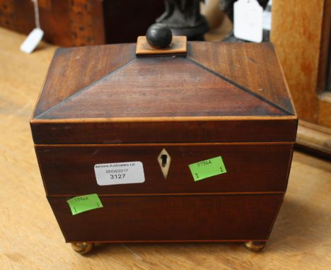 A mid 19th century tea caddy in mahogany