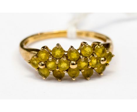 A 9ct gold ring set with citrine stones in a three row lozenge shape, gross weight 2.3 grams approx, size P 