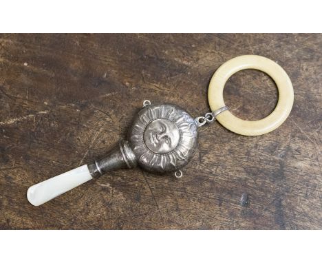 A child's rattle with mother of pearl handle, filled body, Sun with Face, Birmingham date letter rubbed, maker Crisford and N