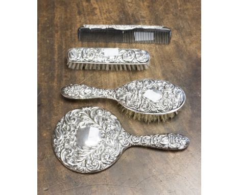  A Victorian style silver four piece mounted dressing table set, including pair of brushes comb and mirror Birmingham 1961 