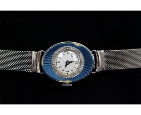 A 9ct white gold guilloche enamel and diamond set Art Deco watch on a 9ct white gold mesh link bracelet (some enamel loose) 