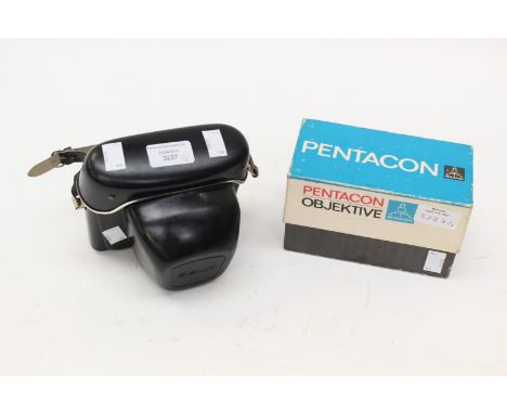 A cased Zenit-E camera together with a boxed Pentacon 'Objektive' 2.8/135 lense.