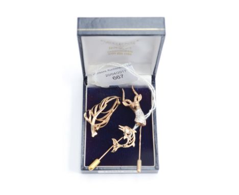 Two 9ct gold stick pins, a Stag, a Marlin, the Stag with cz stones and a leaf brooch (3) 8.6 grams approx 