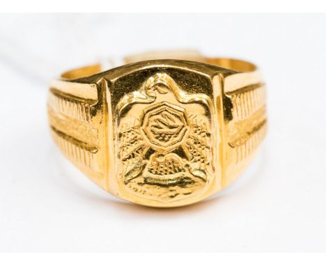 A gold signet ring unmarked, possibly 18-22ct gold, with an eagle detail, size V1/2, total gross weight approx 13.9 gms