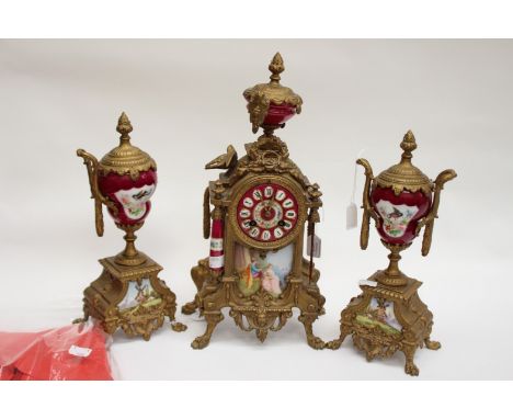 An ormolu mantle clock with garnitures, enamelled dial, with Roman numerals, hand painted decoration throughout, in need of r