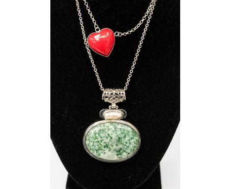 A jade coloured and baroque pearl pendant on a silver chain; together with a coral type and silver mounted heart shaped penda