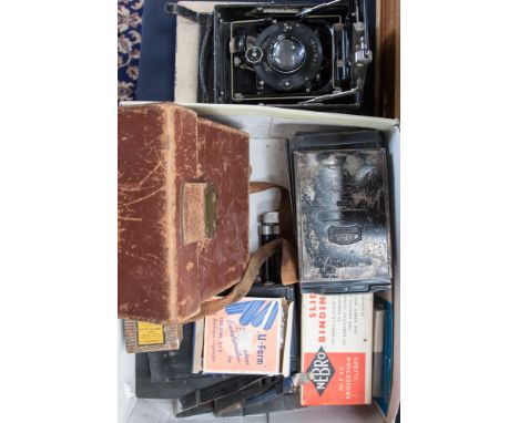 A vintage Zeiss Ikon plate camera; together with negative plates, etc 