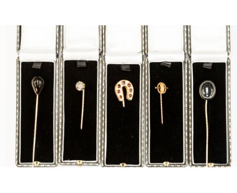 Five Victorian yellow and rose metal stick pins to include one oval banded agate set with glazed compartment to reverse, one 