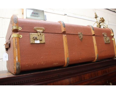 An early 20th Century oak bound travelling trunk canvas body 