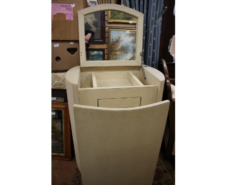 A contemporary Graham & Green vanity and chair unit, cream lizard effect covering, the top opening to reveal a sectioned inte