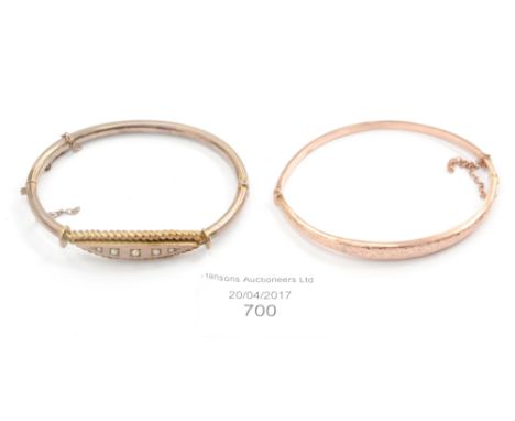 An Edwardian 9ct rose gold bangle with bright cut clover leaf decoration, complete with safety chain, approx 4.5 grams; toget