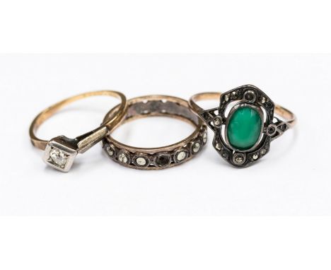 An 18ct gold and diamond ring, size L; together with green stone and marcasite Art Deco ring, size N½ and an eternity ring, s