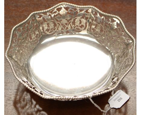 An Italian silver reticulated bowl on three foliate bracket feet, octagonal section with wave band border and chased fretted 