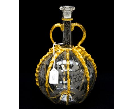 An Italian glass twin handled white decanter, with gilded detail, etched birds and grape design, replaced stopper 