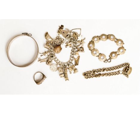 A silver charm braclet, bangle, ring, etc 