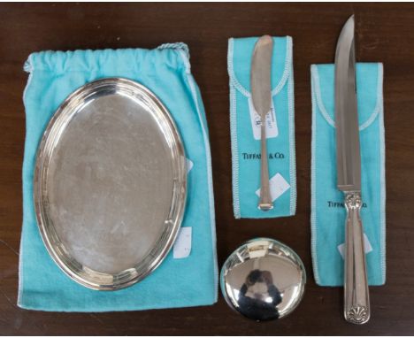  A Tiffany butter knife with dog nose finial, stamped 'sterling; and 'Pat No'; together with a Tiffany steak knife with scall