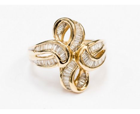 A 14ct gold ring set in a looped bow shape with baguette cut diamonds, gross weight 6.4 grams approx, size Q 