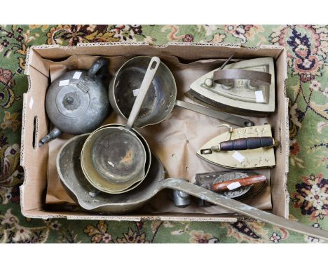 Brass 19th century saucepans and a long handled, saucepan, an Omega spirit iron and timer, two brass irons (water or cinder f