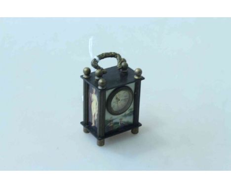 Tiny enamel carriage clock.