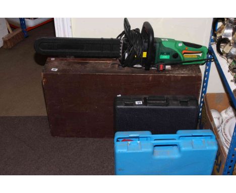 Carpenters tool box, chainsaw, laser level and multi power tool.