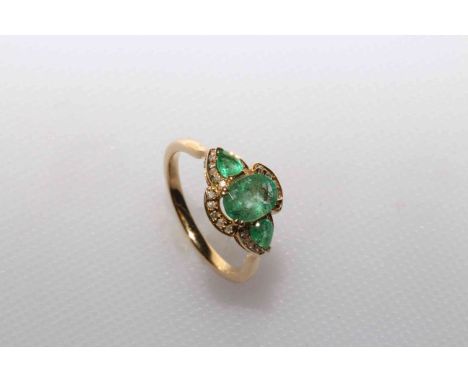 14 carat Yellow Gold Emerald and Diamond ring featuring centre, oval cut, light green Emerald (1.07ct), 4-claw set, with 2 pe