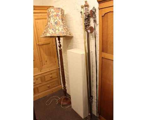 Carved wood standard lamp and shade and three curtain poles.