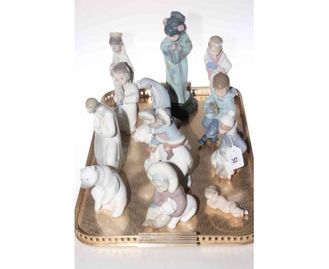 Collection of eleven Lladro figures and one Nao (two with boxes).