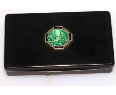 Black lacquer and enamel pocket size domino case, the hinged cover with green enamel roundel of elephant, pig, insect, etc., 