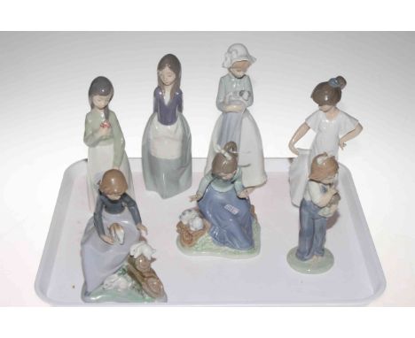 Collection of seven Nao figurines.