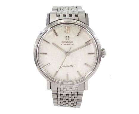 Omega Seamaster gentleman's stainless steel automatic wristwatch, textured silver dial with baton hour markers, on Omega stai