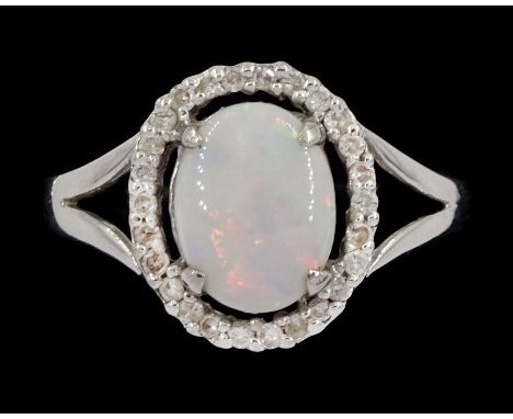 18ct white gold opal and diamond cluster ring, stamped 750Condition Report:Approx 3.2gm, tested 18ct, size O, head = 12.5mm x