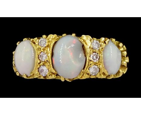 18ct gold three stone opal and six stone diamond ring, London 1966Condition Report:Approx 7.6gm, size M-N, two opal large chi