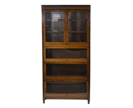 Globe Wernicke style oak bookcase, in two sections, the upper section with glazed cupboard, the lower section fitted with thr