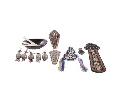 Two Oriental white metal pockets, pierced scrolling designs, one with fish, 12.5cm long; a Chinese silver menu stand, stamped