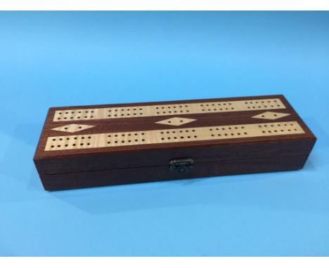 A mahogany cribbage board