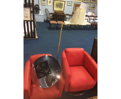 Pair of red swivel chairs and a lamp