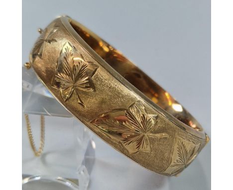 9ct gold engraved ladies bangle. 6.5cm diameter approx. 30g approx. (B.P. 21% + VAT) 