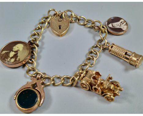 9ct gold curb-link charm bracelet to include: heart shaped padlock, vintage car, bloodstone revolving fob etc. Total weight 3