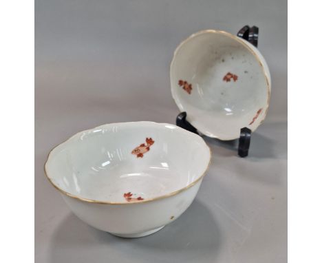 Pair of Chinese porcelain small bowls, moulded as flowerheads with four iron red enamel hand-painted fish to the interior and