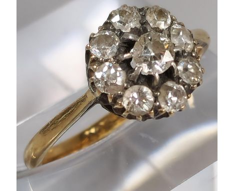 18ct gold nine stone flowerhead cluster ring. 2.1g approx. Size K1/2. (B.P. 21% + VAT) 