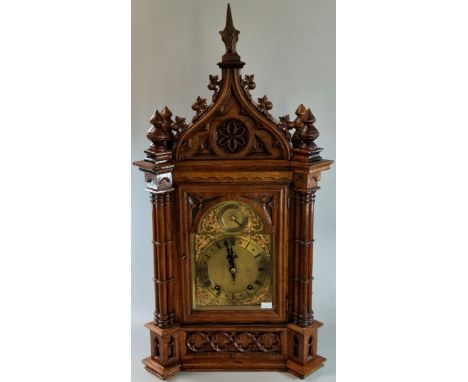 Late 19th century German gothic design two train bracket clock, having pointed arched pediment with baluster finials above ar