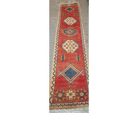 Traditional hand woven vintage Middle Eastern design runner with five geometric medallions, and repeating stylised multi-colo
