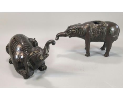 Two Oriental, probably Japanese bronze 'Suteki' water droppers in the form of mythical Baku Elephants, one recumbent the othe