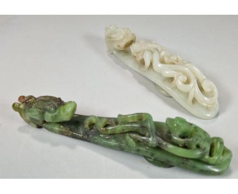 Two finely carved Chinese Dragon and Chilong green and white hardstone belt hooks, each with the dragon head and Chilong to t
